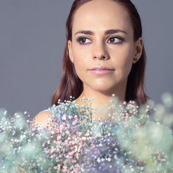 Alex Rivera, Lead Design Curator at Prime Bridge Craft, reviewing corporate floral arrangements